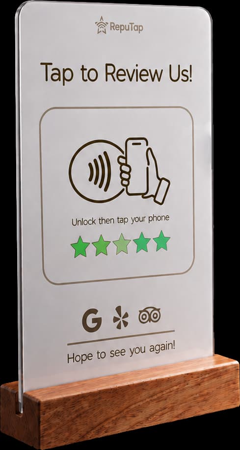 A RepuTap 'Tap to Review Us!' NFC stand on a wooden base
